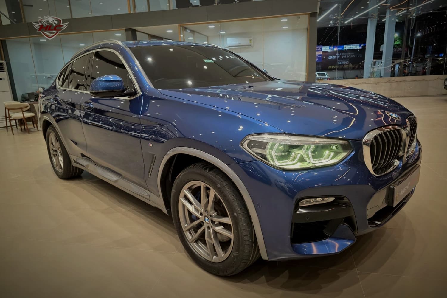 BMW X4 xDrive30i M Sport in Phytonic Blue at the showroom